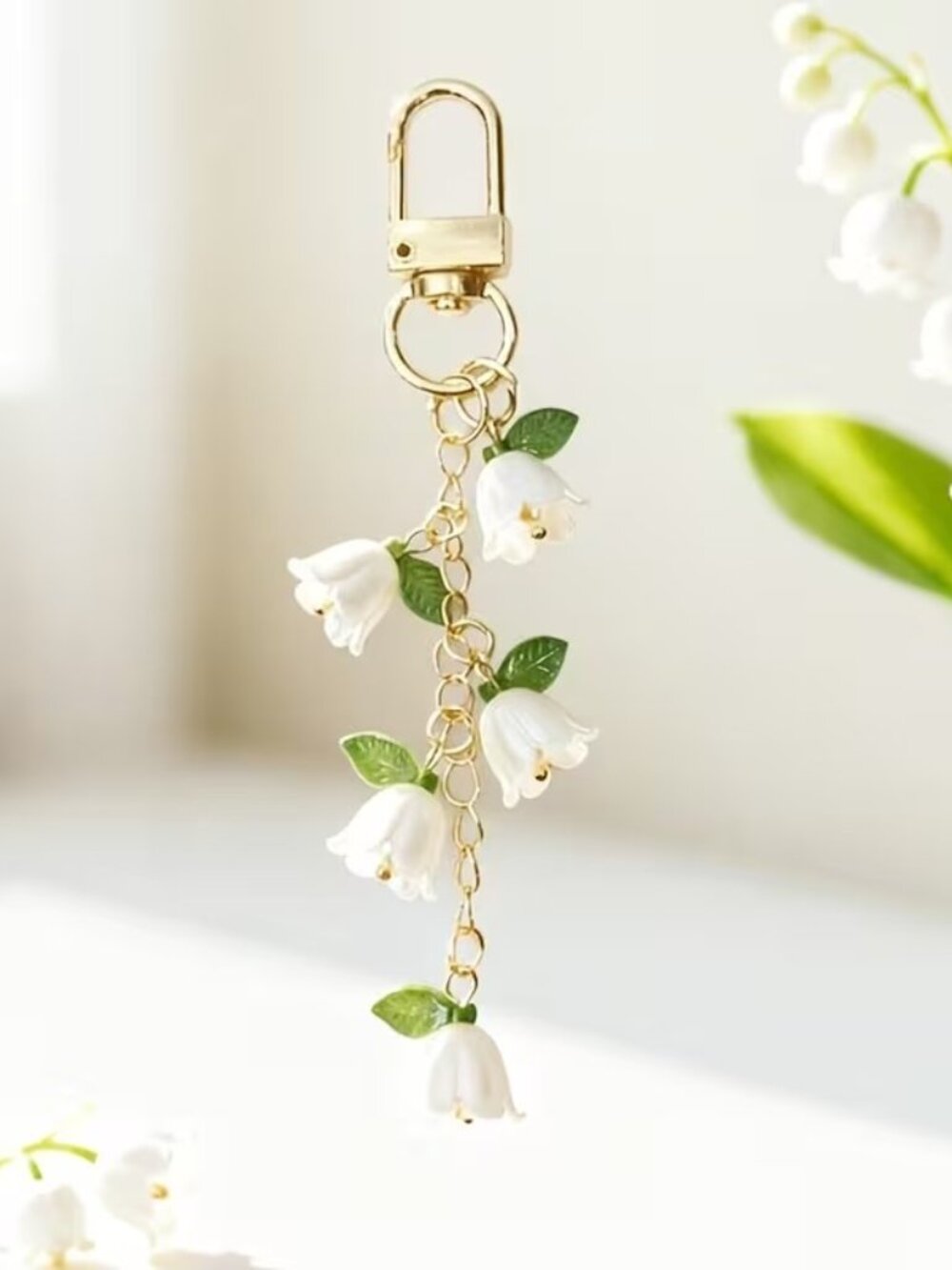 Gold-Tone White Floral Drop Bag Charm with White Petals and Green Leaves - Picture 1 of 2